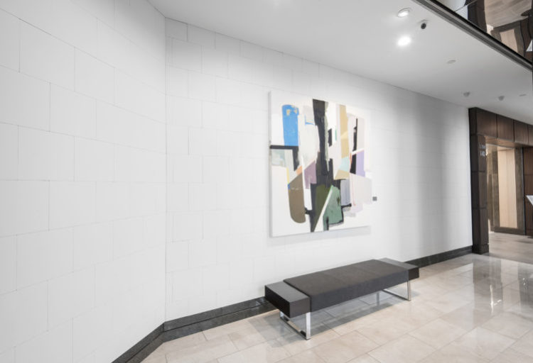 office building waiting area with white leather walls