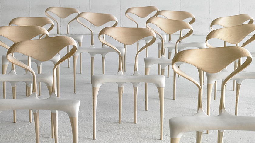 group of armless sculptural dining chairs in bleached ash