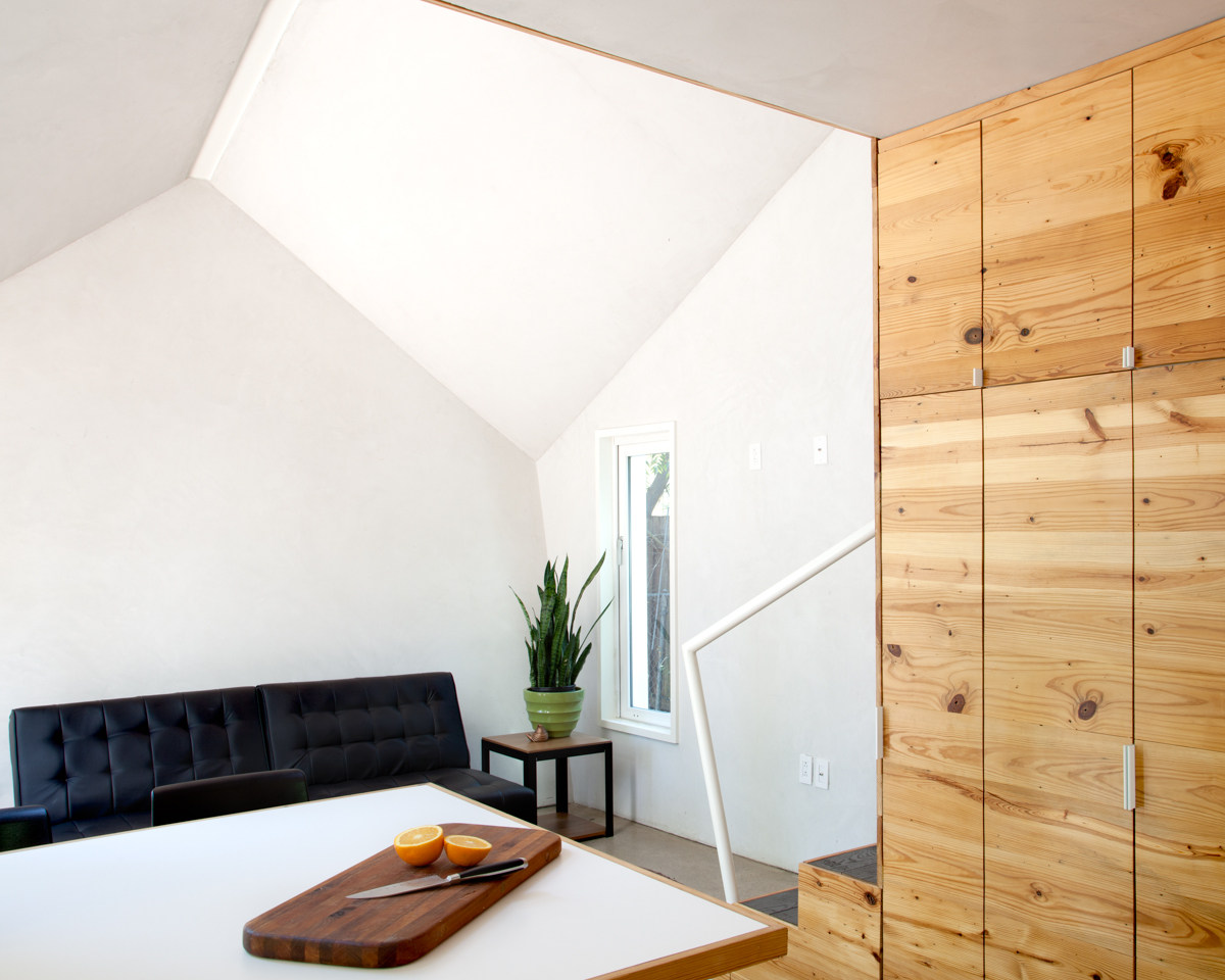 Hive Guesthouse upstairs workspace with view of pine paneled wall