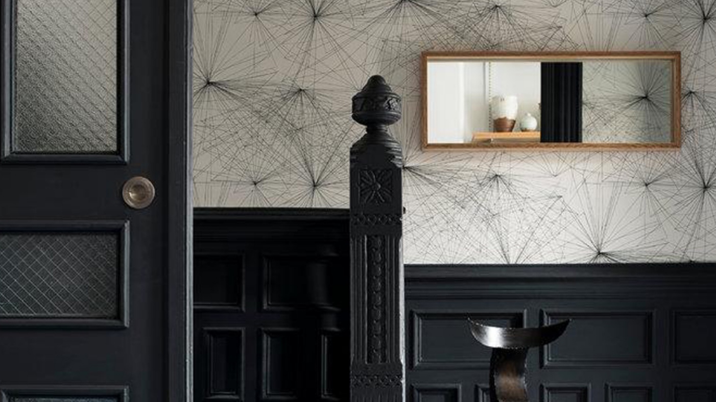apartment wall with white wallpaper in background featuring flight map pattern