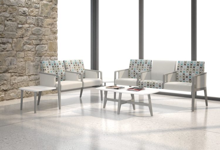 Five Krug Faeron healthcare armchairs in contrast pattern and gray upholstery with one bariatric chair style