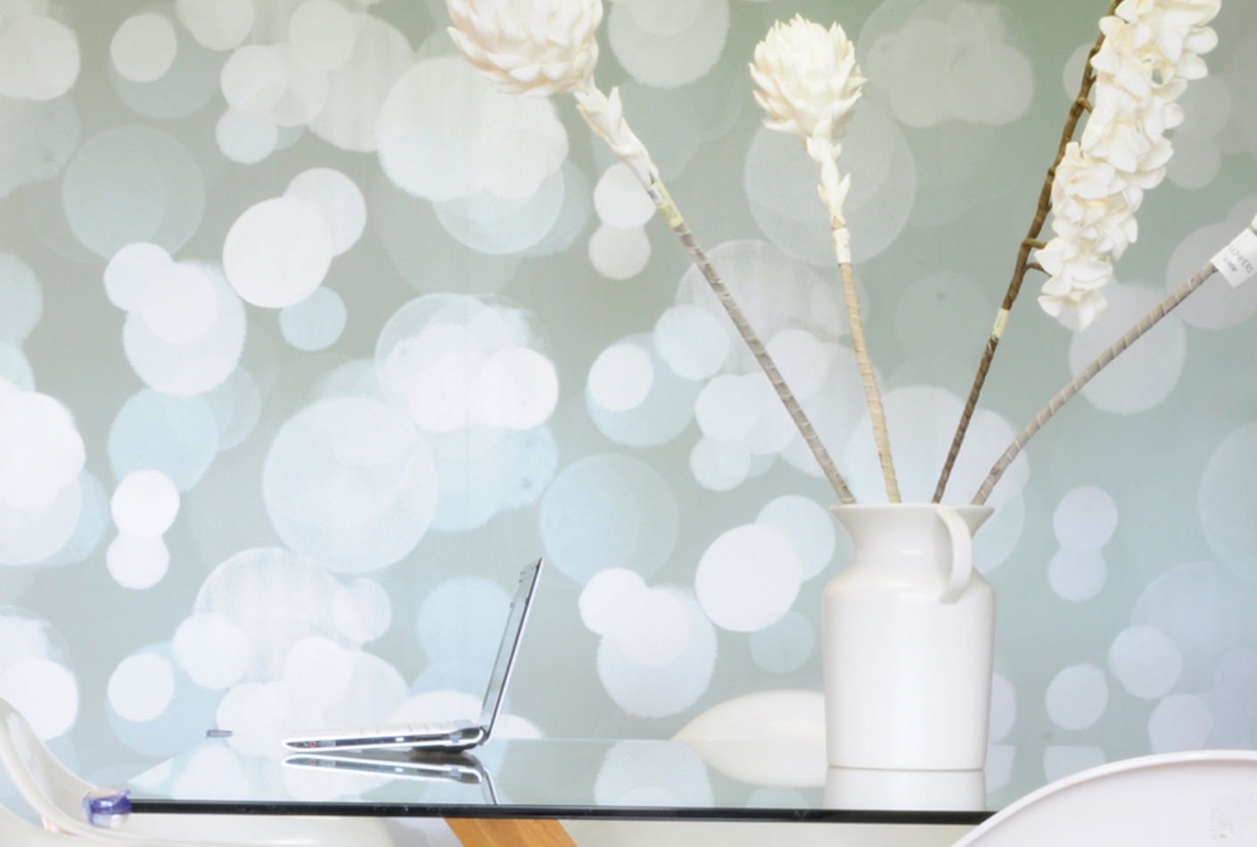 close-up of wallpaper with blue background and white haloed lights
