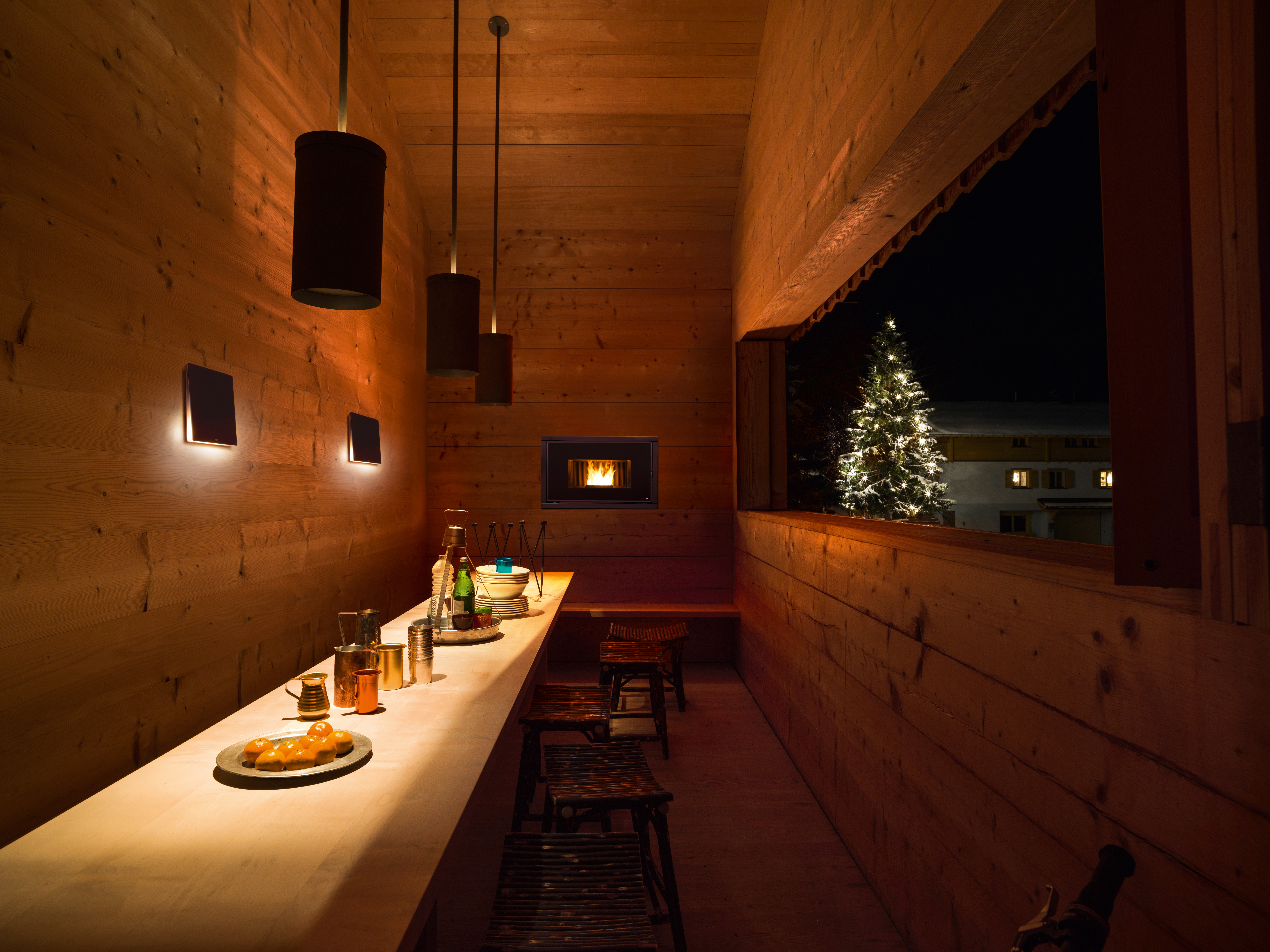MCZ Wood Burning Fireplace installed in dining room with pine walls