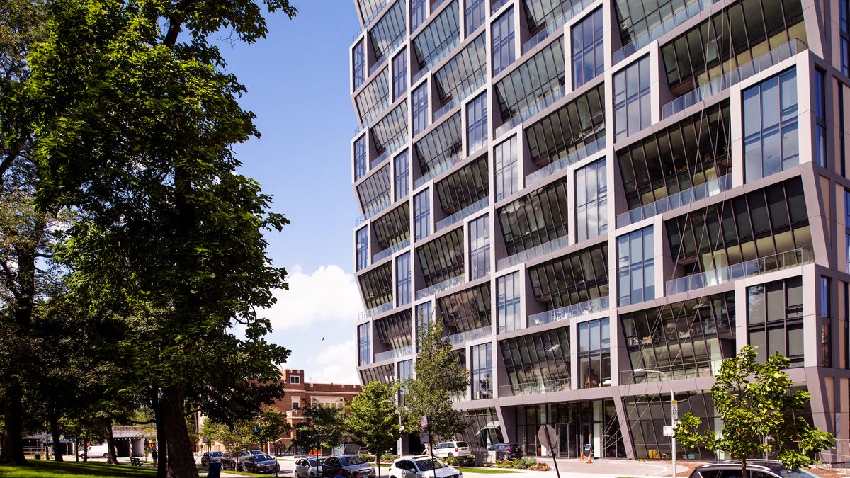 outside detail of glass tower with angled windows for solar carving