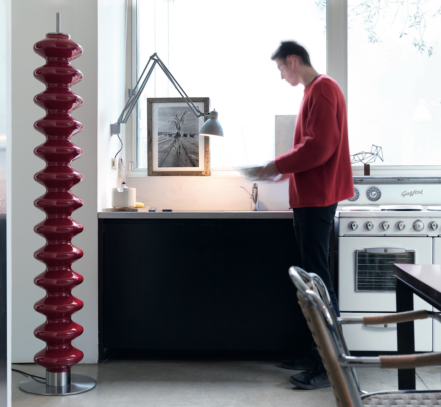 Tubes Radiatori Milano Heater in red inside man's apartment