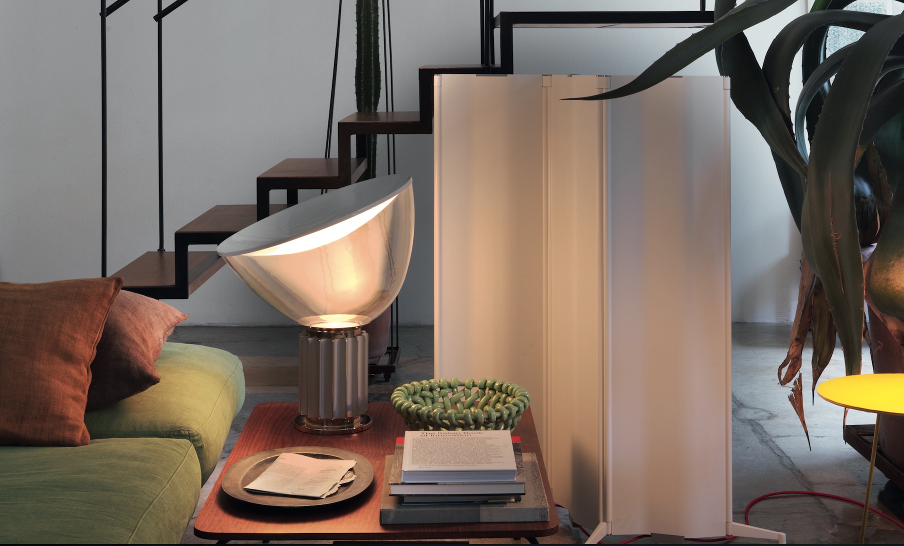 Tubes Radiatori Origami heater in white next to lamp and staircase