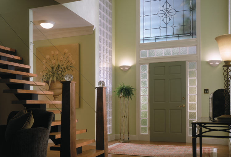 Hy-Lite Acrylic and Glass Block window with decorative elements above doorway
