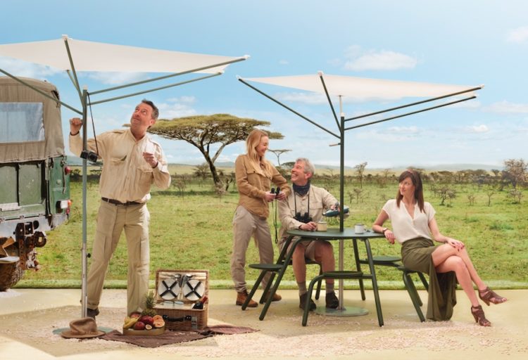 people outdoors beneath minimalist parasol