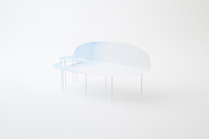 thin metal bench painted in soft blue and white