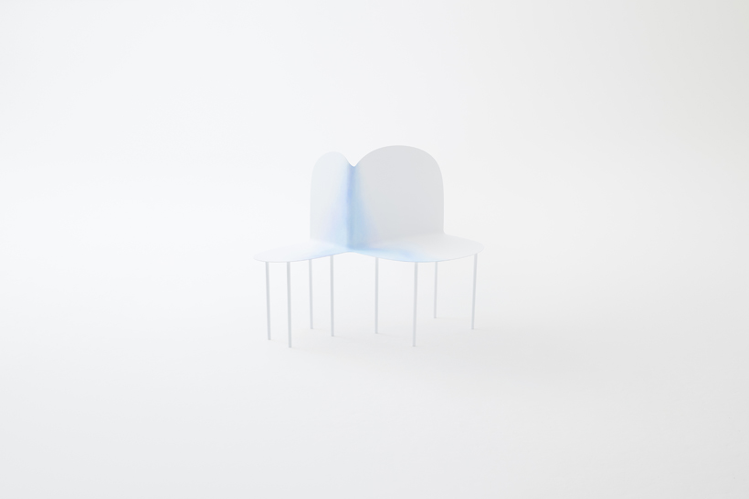 thin metal chairs with two seats melded together