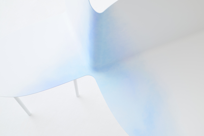 detail of hand-painted double metal chairs