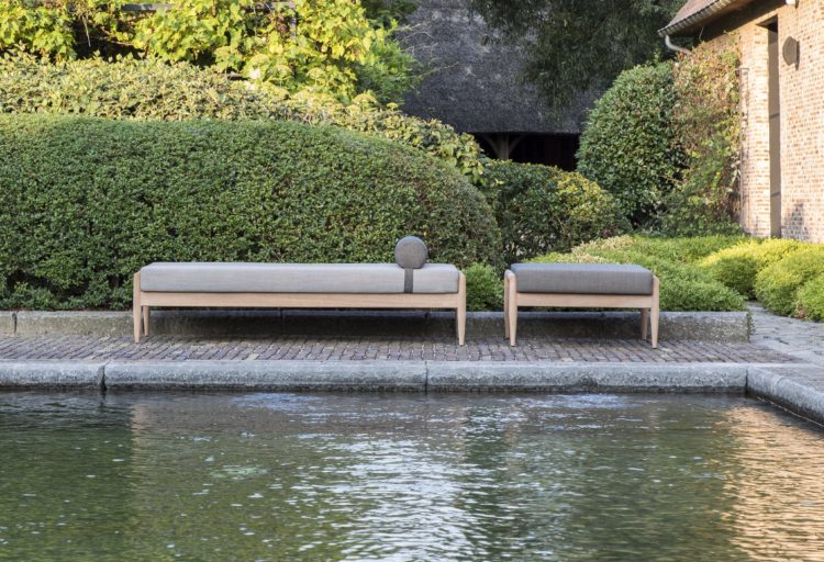 outdoor daybed and ottoman pictured next to pool