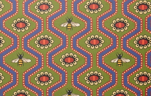 wallpaper with geometric design featuring bees and eyes in purple and green