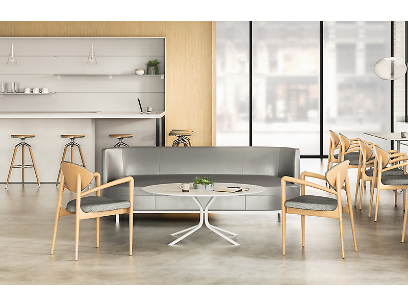 Karina Guest Chair in cafe setting many chairs light oak