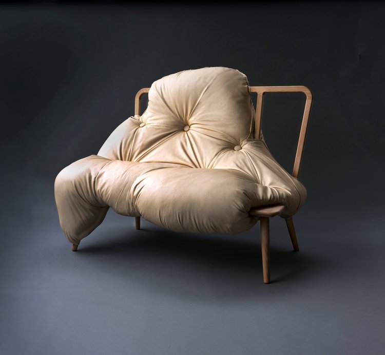 irregular sofa with soft upholstery taking over steel frame