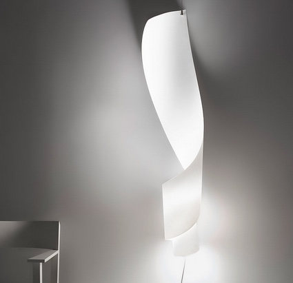 wall lamp made of curled paper pinned to wall