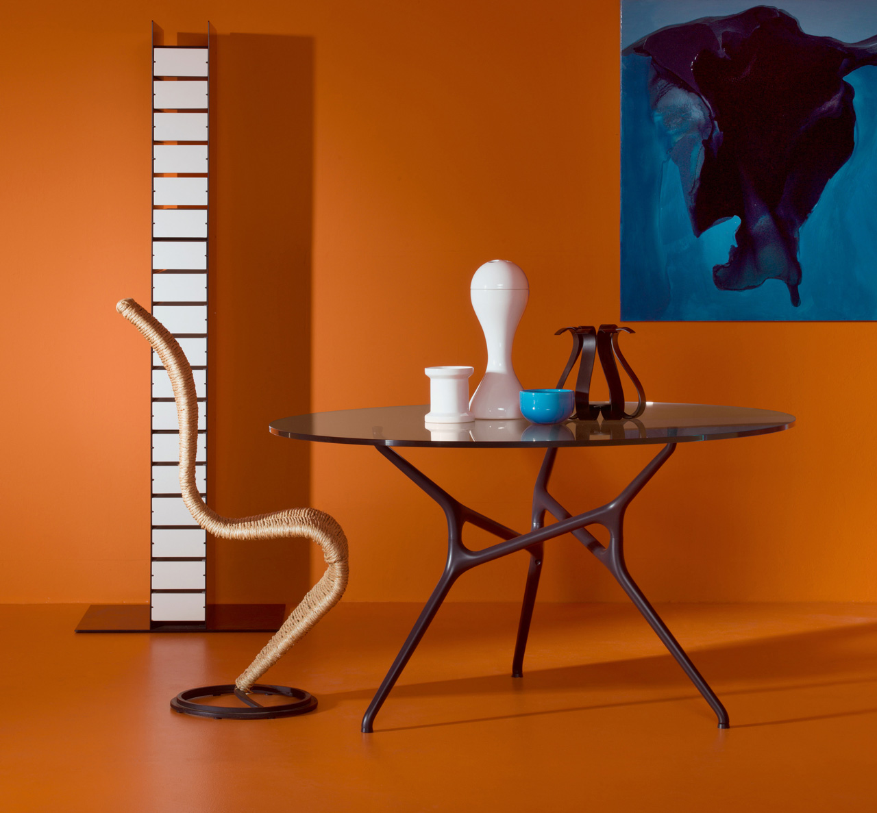 Tom Dixon S Chair in natural wicker with coffee table in orange room