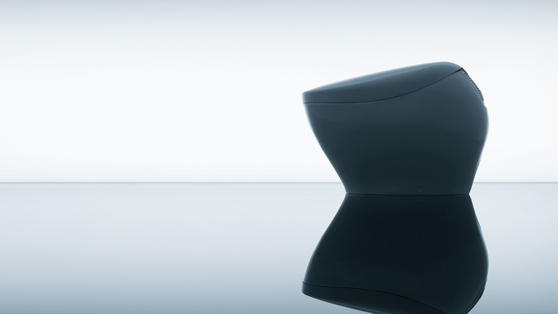 organically shaped skirted toilet with personal cleaning technology