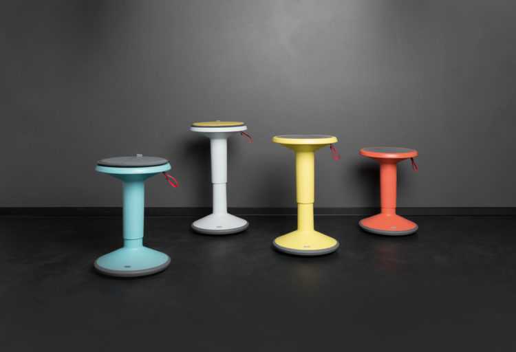 four height-adjustable stools in bright modern colors