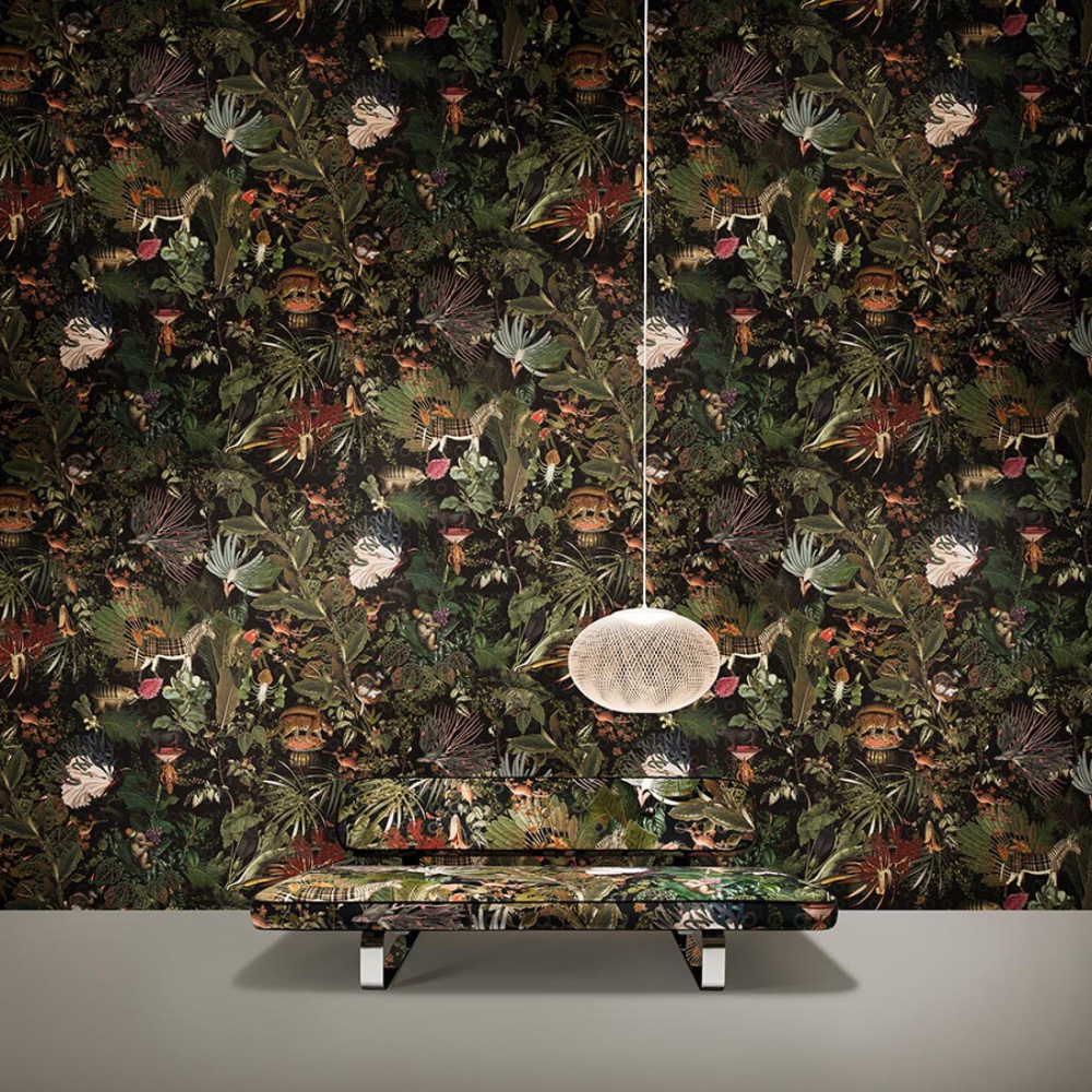 black wallpaper woth green foliage and hidden extinct animals
