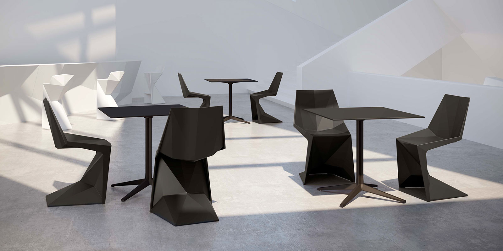 group of black poly outdoor chairs and tables