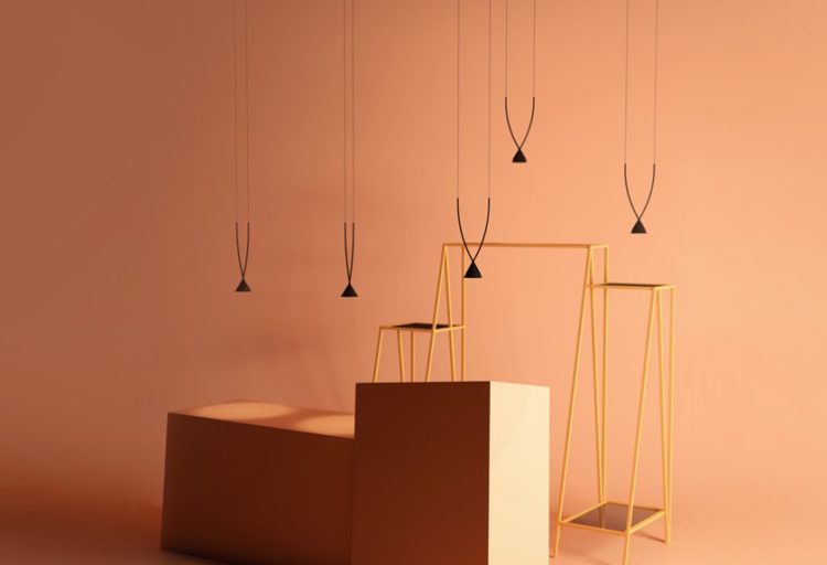Axolight's Jewel Pendant five pendants at different heights against peach color background