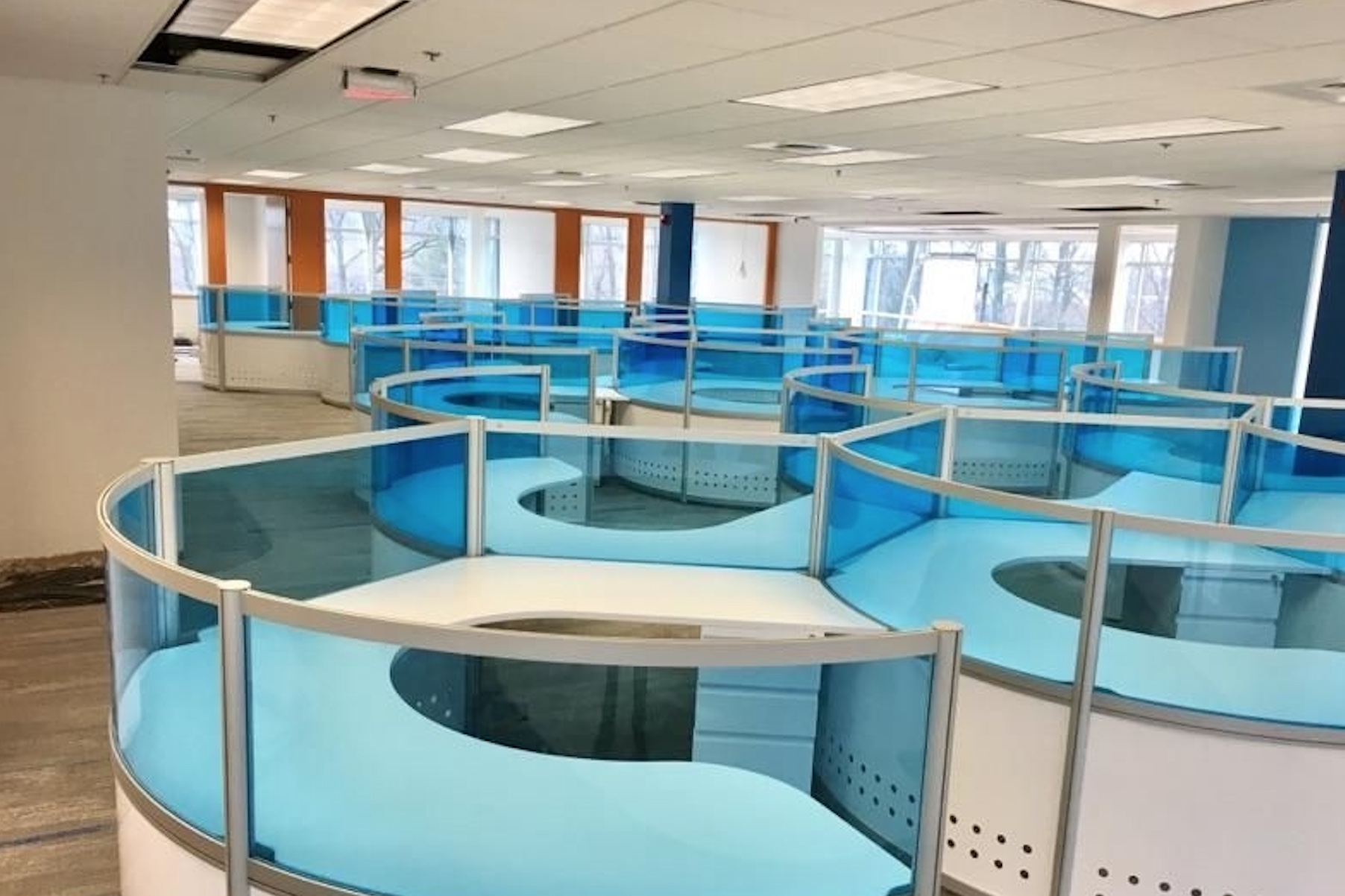 Fluid Concepts Orbit Workstations linked white with blue tinted screens