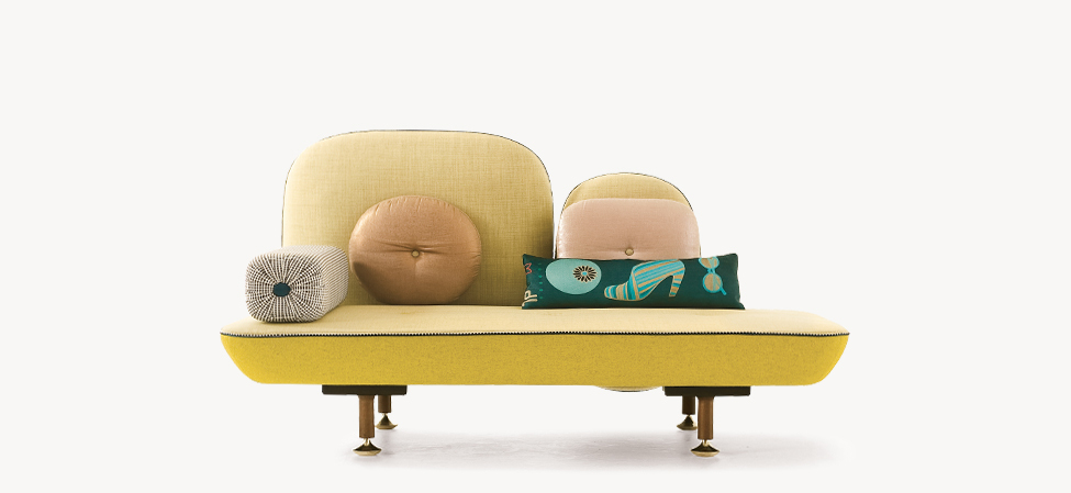 ywllow sofa with throw pillows and pillow back