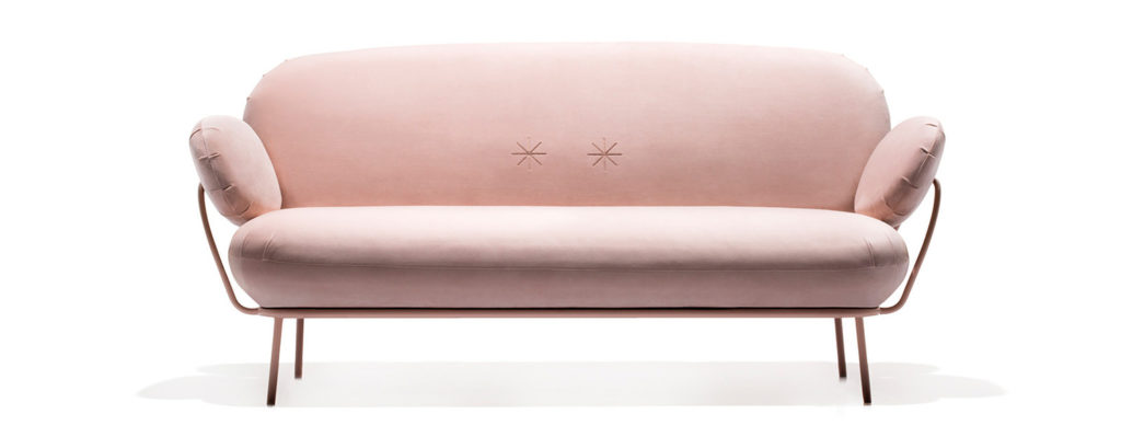 pink upholstered sofa with wire frame