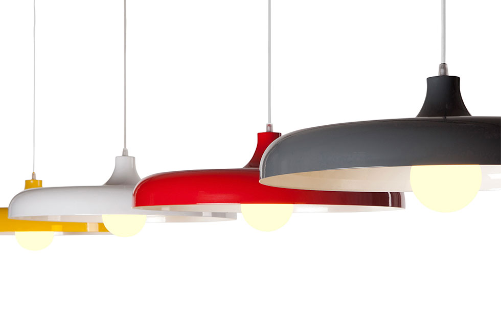 four colorful metal pendant lamps against white background