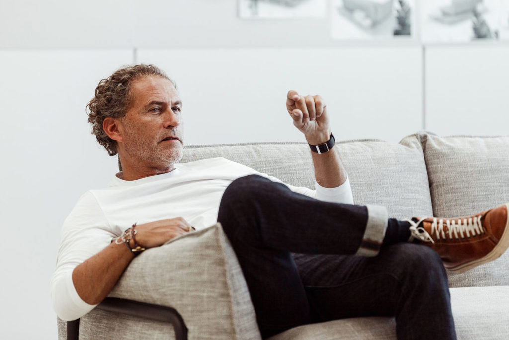 Werner Aisslinger Design Werner Aisslinger speaking while sitting in sofa