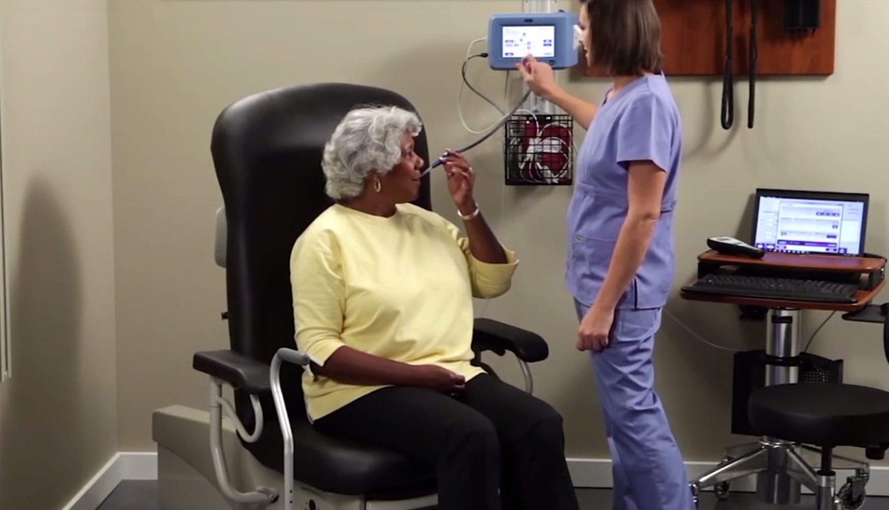 Midmark's IQvitals nurse and patient with tube in mouth