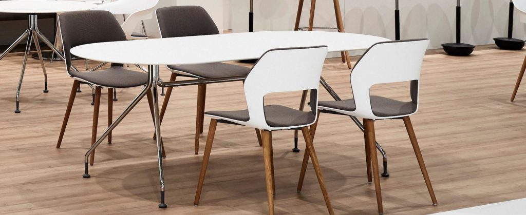 Wilkhahn Occo Side Chair four chairs with charcoal upholstery and white shell in conference setting