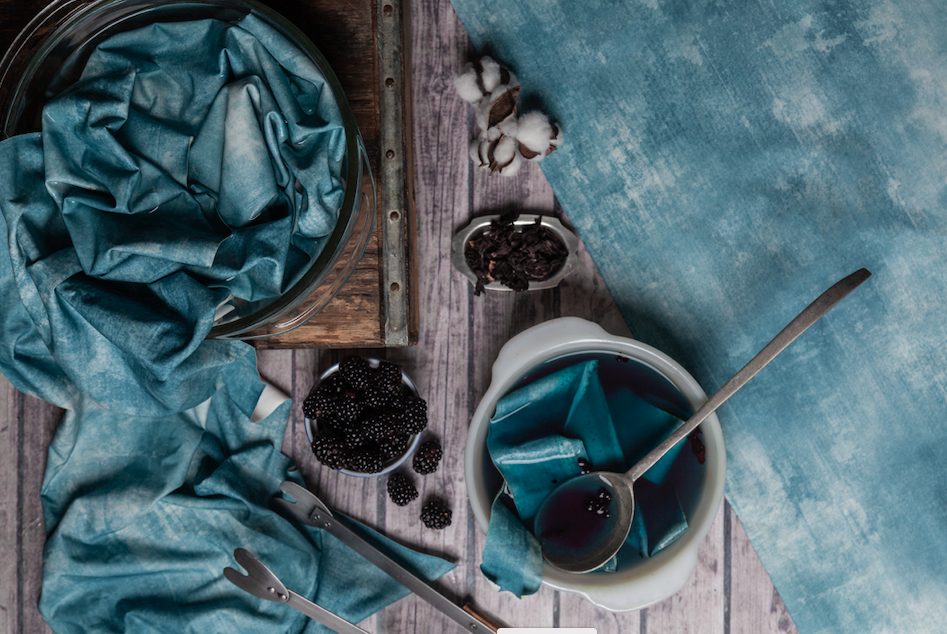 blue stone wash textile with blackberries and other spices