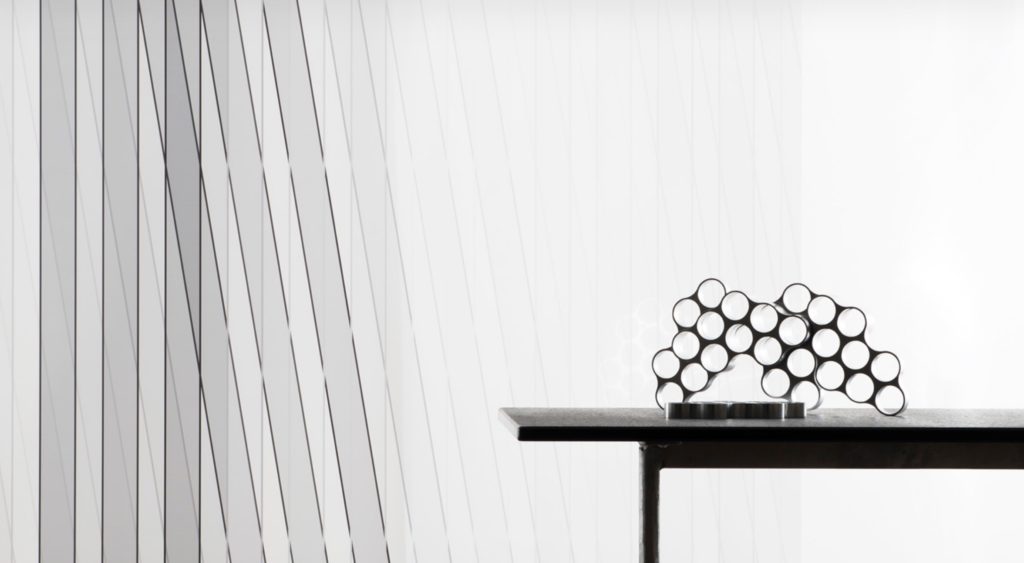 Skyline Design Oblique and Chevron Collection black and white and table with small glass sculpture