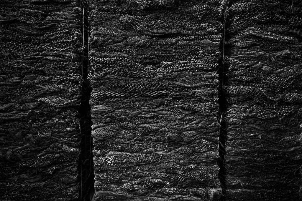 close-up of collected black fishing nets