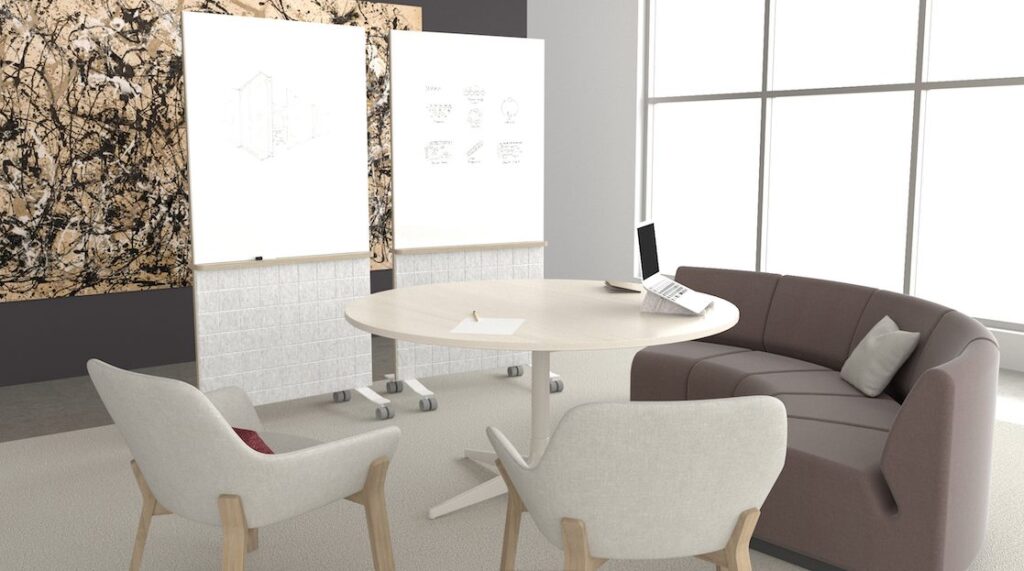 office lounge with circular tables, sofa, chairs, and two mobile room dividers