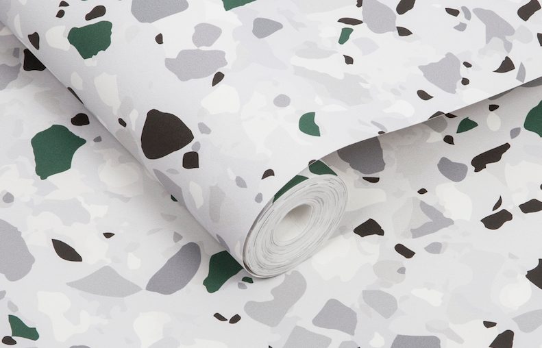 close-up of terrazzo-inspired wallpaper with green accents