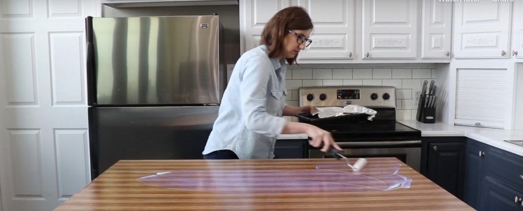 Giani Butcher Block Paint Kit applying topcoat to kitchen island