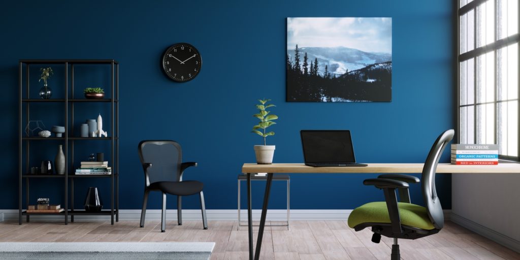 Side view of Nightingale LXO chair with green upholstery in office environment.  