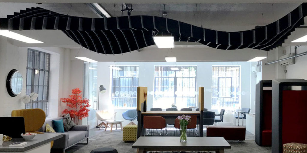 front view of ezoBord Acoustical Net in black on ceiling of casual office