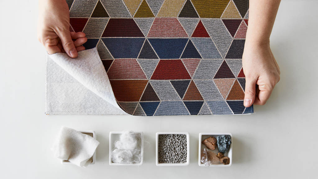 Celliant textiles DesignTex collection single textile with trapezoidal pattern and different colors with demonstration of the different minerals used. 