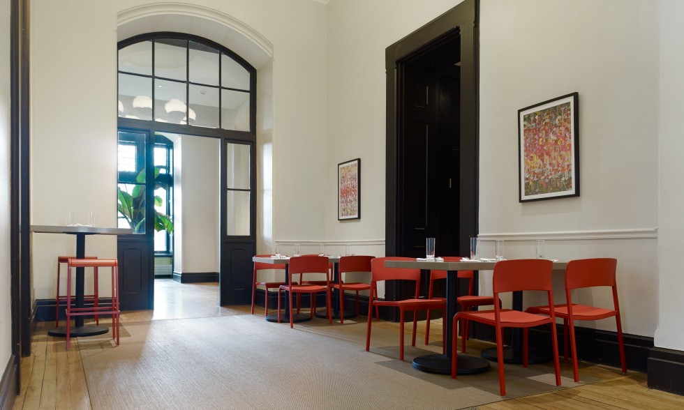 Source International Viiva Chairs in restaurant eight red chairs and two red stools