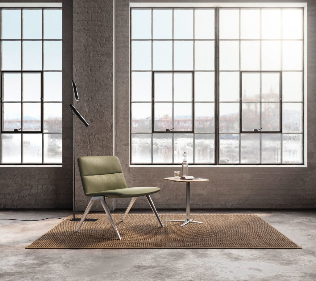 Davis Furniture A-Lounge with green upholstery in open work area