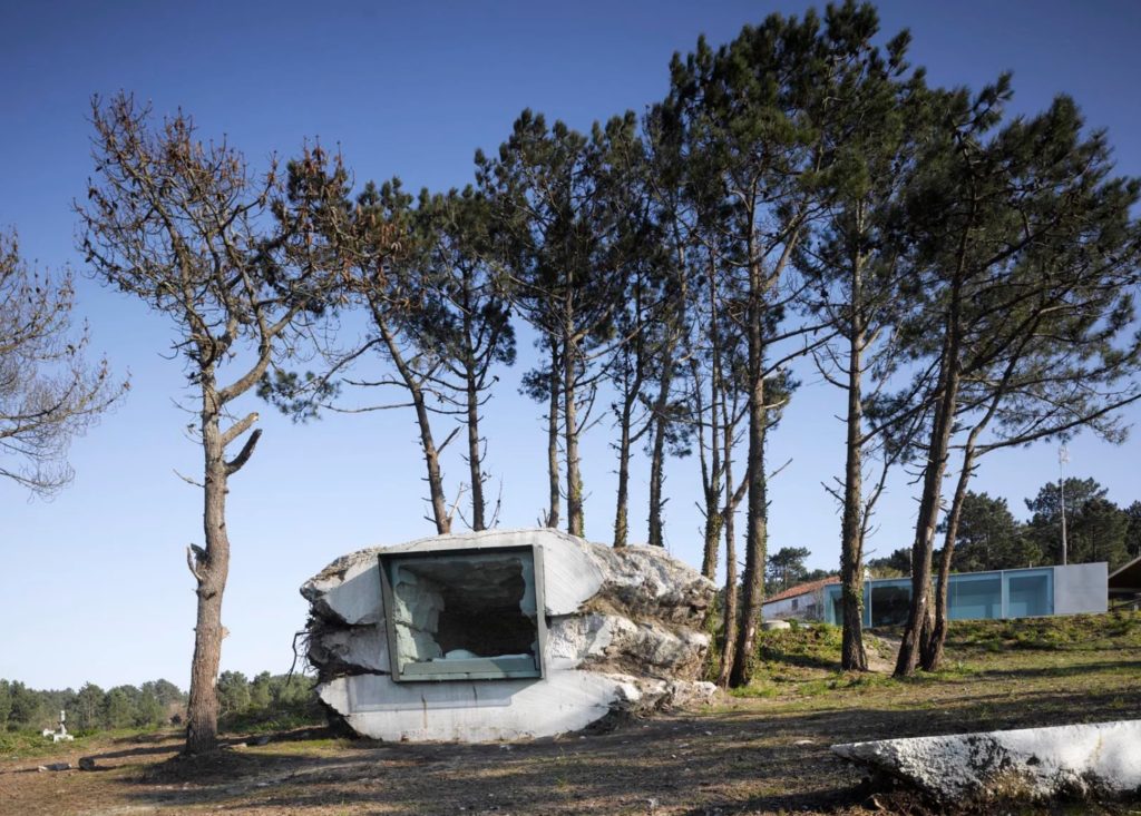 Truffle House Exterior from a distance with window in front surrounded by trees