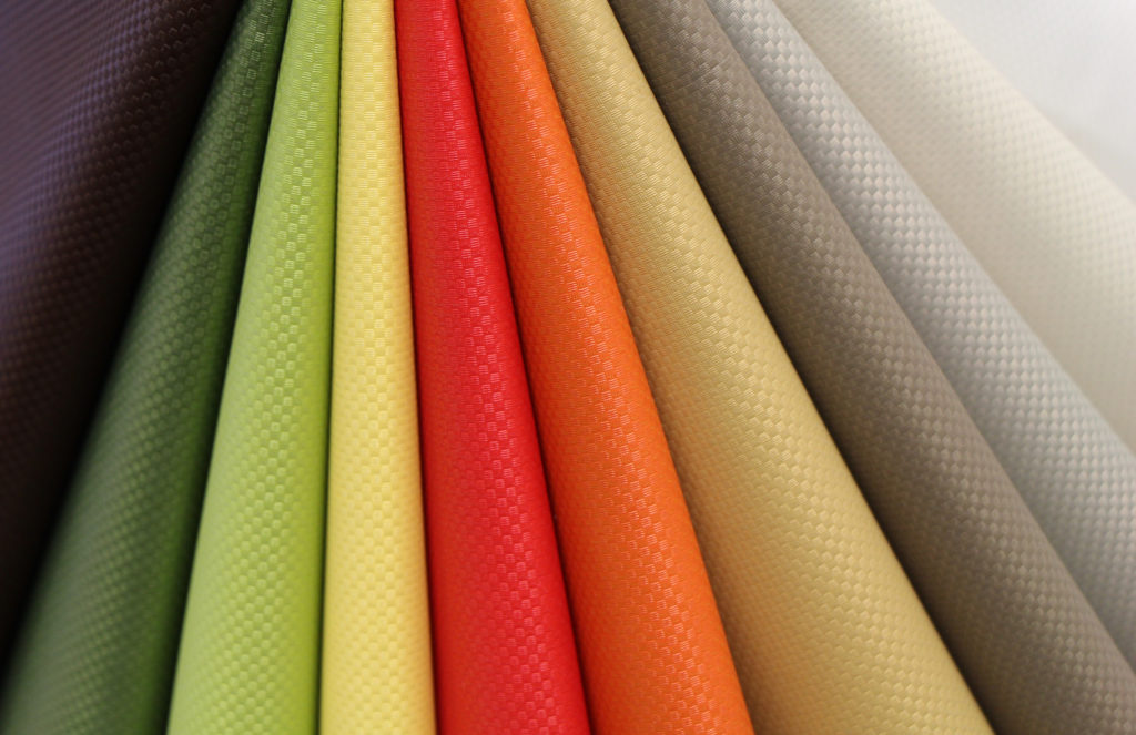 Ultrafabrics textiles close-up of 10 different colors from portfolio, including red, orange, yellow, green