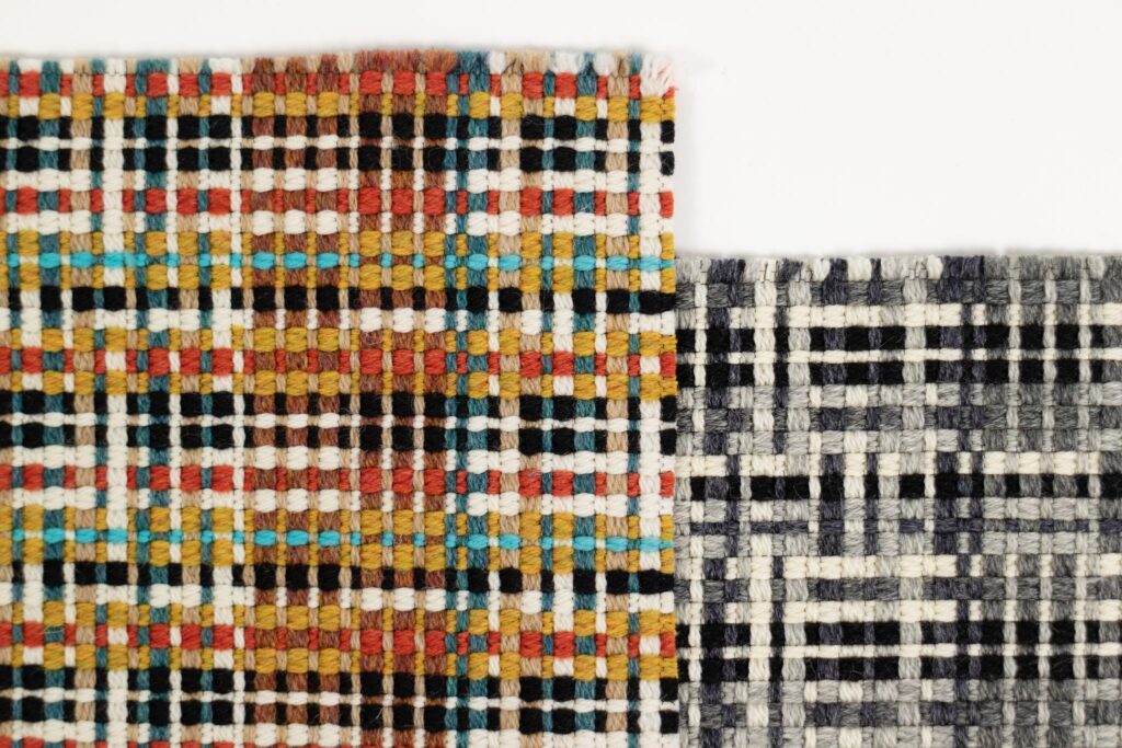 Designtex + Stölzl criss-cross pattern of tight lines in orange, rust, aqua, brown, black, and white