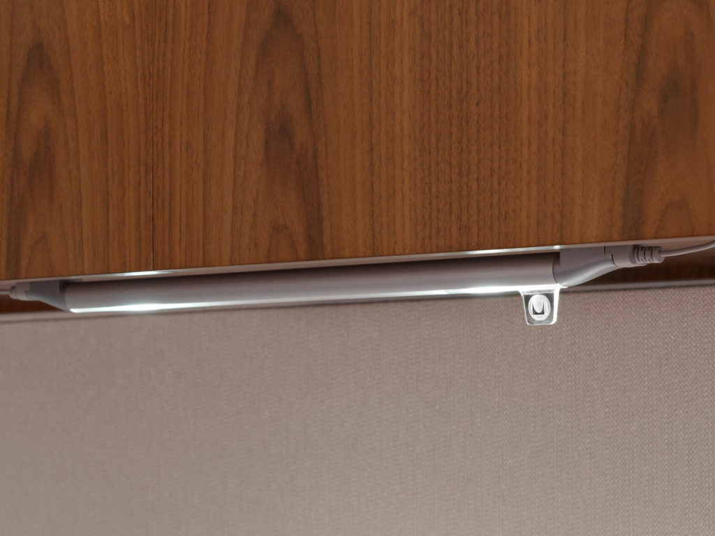 Yves Béhar Herman Miller Twist Task light mounted to wood veneer cabinetry