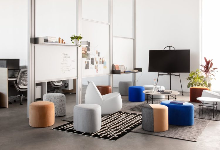 Alsteel Two-Thirds seating in office several round poufs in different colors