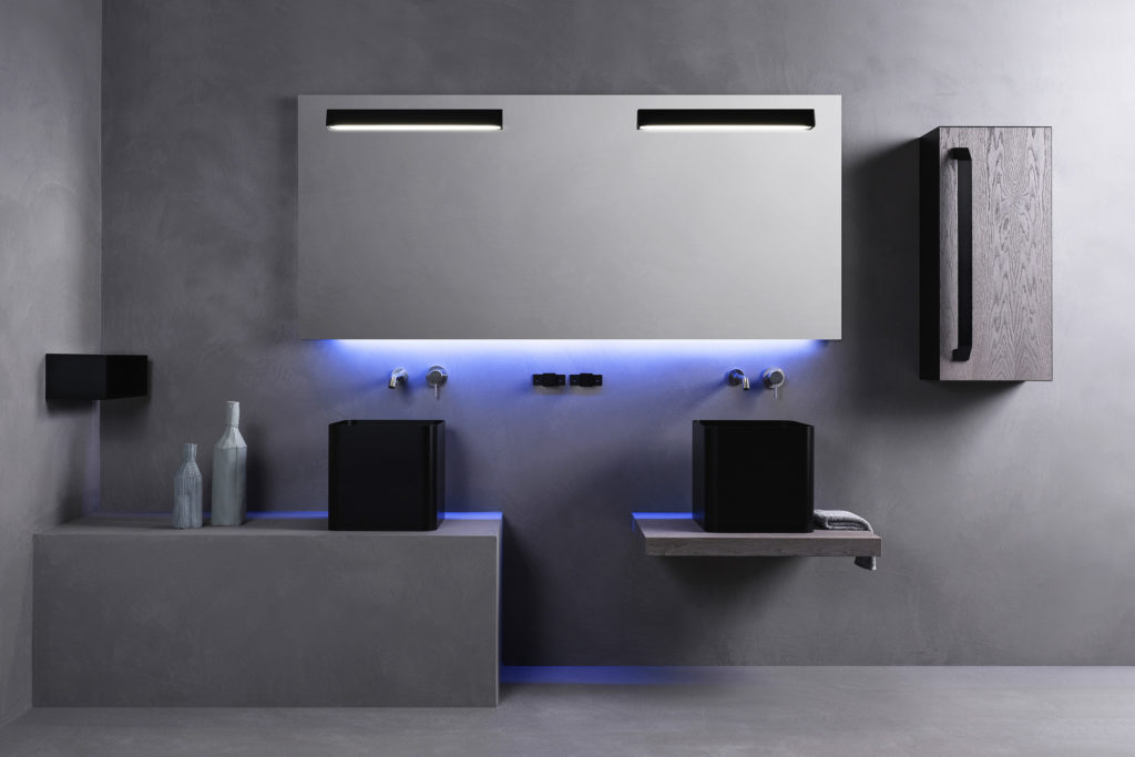 Atelier 12's Abisso Bathroom two black square basins, stainlees steel medicine cabinet, and gray floor furniture unit